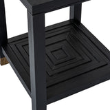 Close-up of the Hill Interiors Harweld wooden side table in matt black, showing the lower square shelf with concentric raised panelling and squared legs.