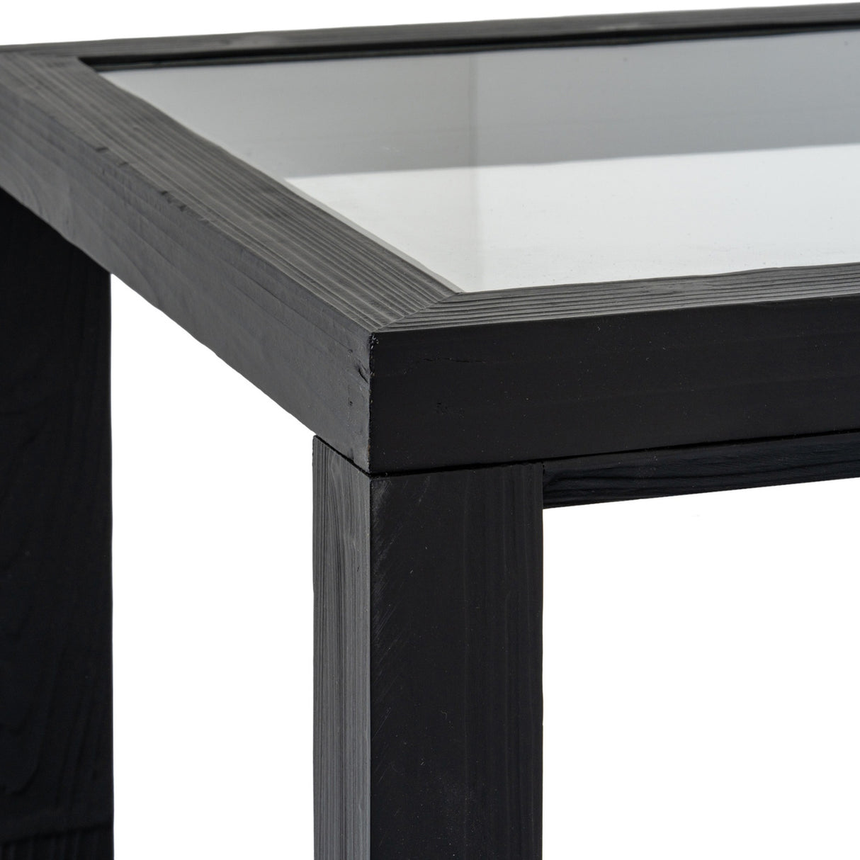 Close-up of the Hill Interiors Harweld wooden side table in matt black, showing the square glass-inset top and solid timber leg against a white background.
