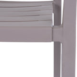 Close-up of the Hill Interiors Stone Carver Accent Chair in beige, showing the moulded seat edge, slatted detail and slender leg in a matte stone finish.