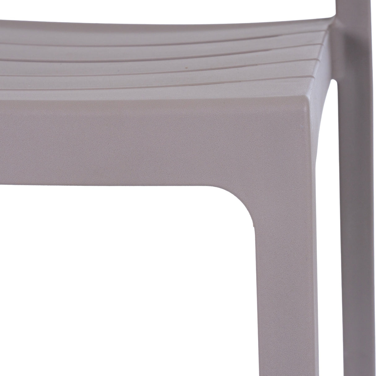 Close-up of the Hill Interiors Stone-Effect Moulded Accent Chair in beige, showing the matte plastic seat edge and squared front leg.