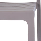 Close-up of the Hill Interiors Stone-Effect Moulded Accent Chair in beige, showing the matte plastic seat edge and squared front leg.