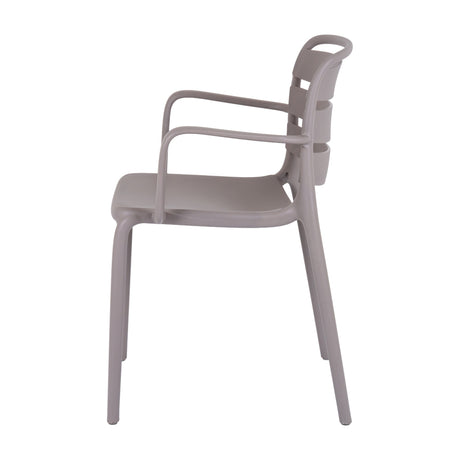 Side view of Hill Interiors Stone Carver beige plastic accent chair with slatted back, curved arms and matte finish on a white background.