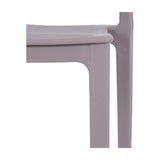 Close-up of the Hill Interiors Stone-Effect Moulded Accent Chair in beige, showing the matte plastic seat edge and rounded leg against a white background.