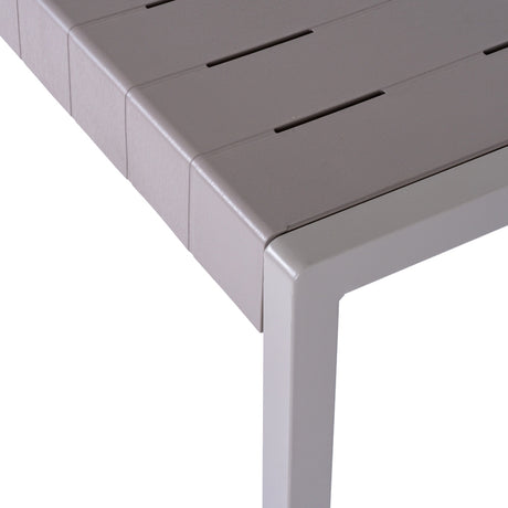 Close-up of Hill Interiors Cube Stone-Effect Side Table in beige, showing slatted top edge and squared moulded plastic leg on a white background.