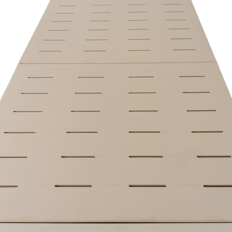 Hill Interiors Woven-Top Side Table in beige, close-up angled view of the moulded plastic surface showing rows of slotted grooves across its length.