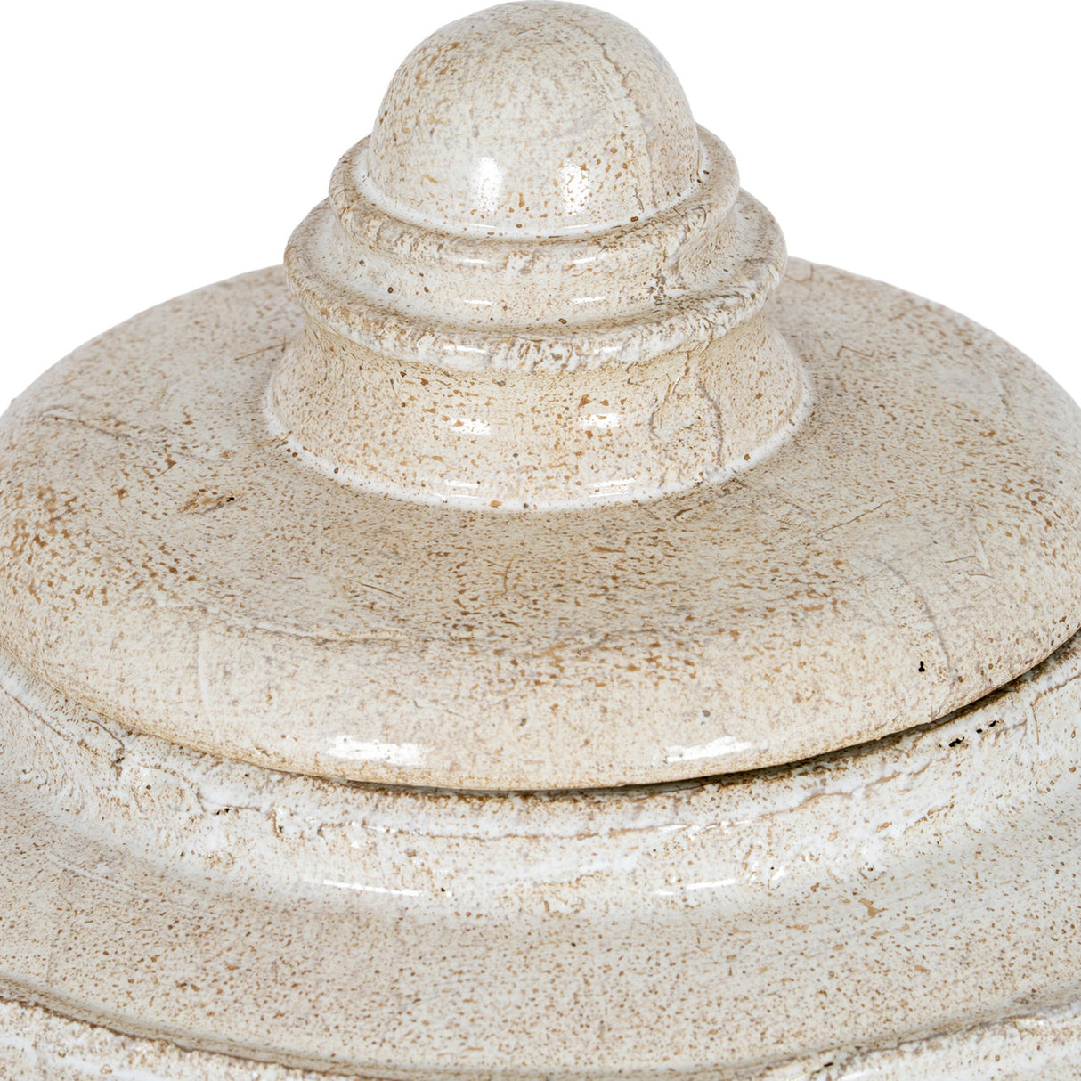 Close-up of the domed lid and tiered finial on the Hill Interiors Large Ceramic Pot in a distressed white glaze with warm speckled tones.