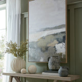 Hill Interiors Large Globe Ceramic Vase in white with vertical ribbing, holding yellow foliage on a wooden console beside decorative balls and dark jugs.