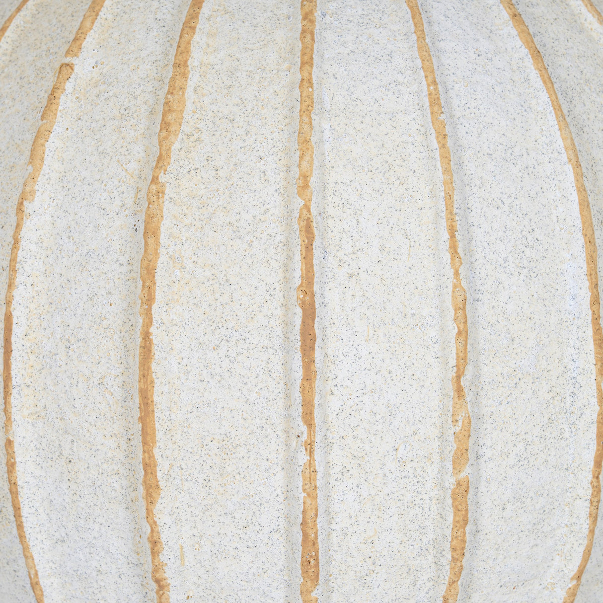 Close-up of Hill Interiors Large Globe Ceramic Vase in white, showing the speckled matte surface and raised vertical ribs in warm tan tones.