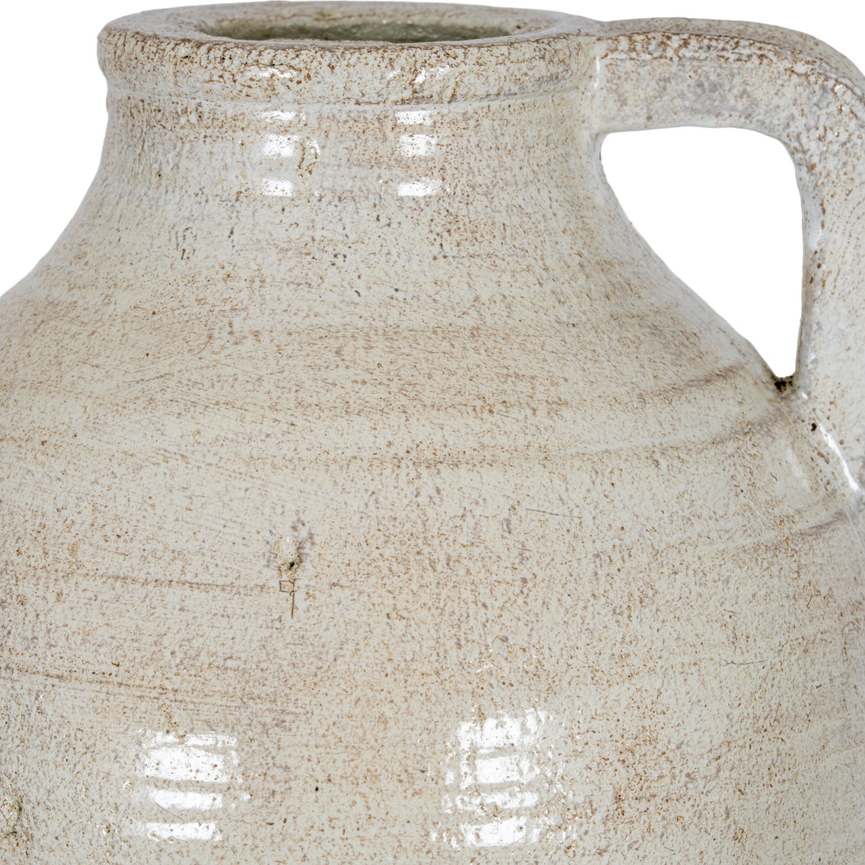 Close-up of the Hill Interiors Medium Ceramic Jug in white, showing the rim, angular handle and softly weathered glaze over a rounded body.