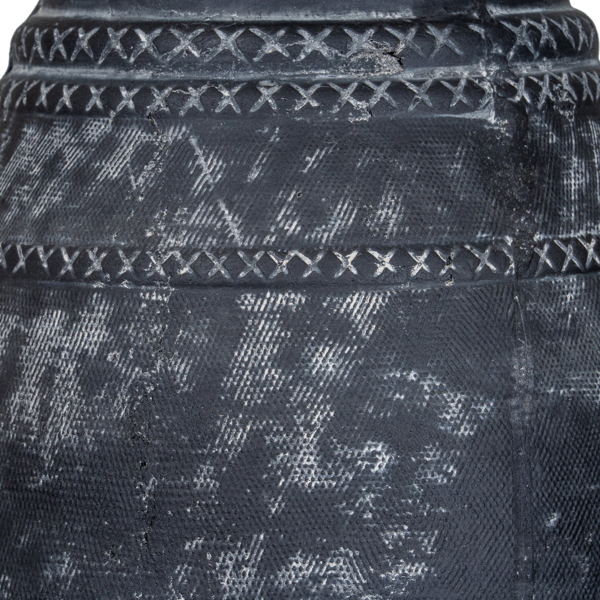 Close-up of Hill Interiors Etched Tall Ceramic Vase in black, showing textured banded surface with cross-stitch detailing and matte glaze finish.