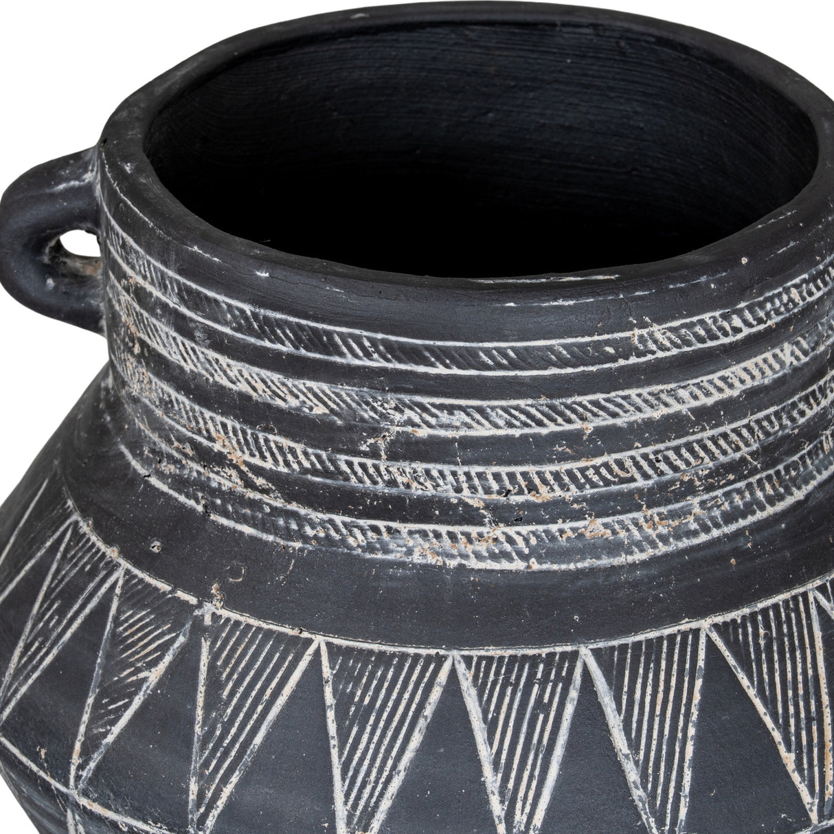 Close-up of Hill Interiors Tall Etched Ceramic Planter in black, showing the side handle, ribbed neck and etched triangular pattern on the glazed surface.