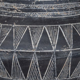 Close-up of the Hill Interiors Tall Etched Ceramic Planter in black, showing banded triangle etching and a smooth glazed finish with white detailing.