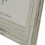 Close-up of the Hill Interiors white wooden photo frame corner, showing the distressed painted finish and 203.2 x 254mm size label on the insert.