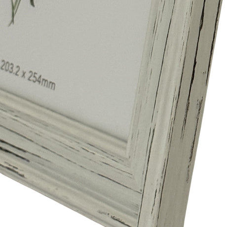 Close-up of the Hill Interiors white wooden photo frame corner, showing the distressed painted finish and 203.2 x 254mm size label on the insert.
