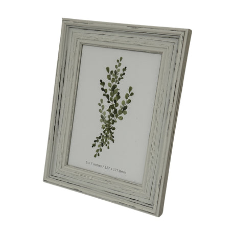 Hill Interiors white wooden 5x7in photo frame with a distressed painted finish, displayed upright at an angle on a plain white background.