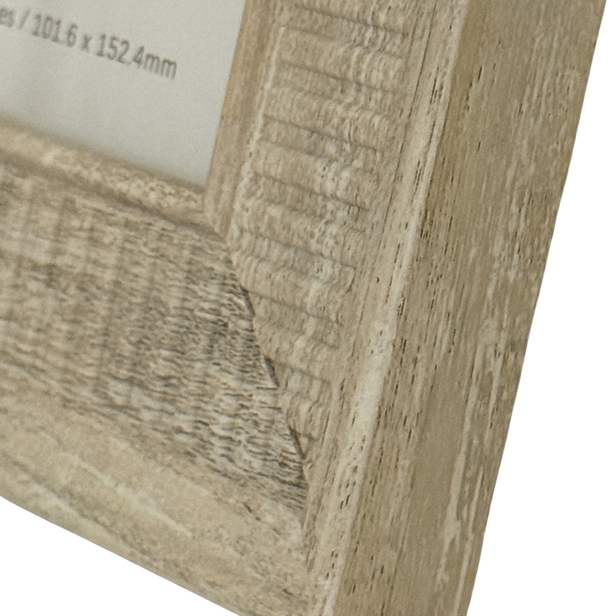 Close-up of the Hill Interiors White Wooden Photo Frame corner, showing the painted wood grain finish and 4x6 aperture edge.