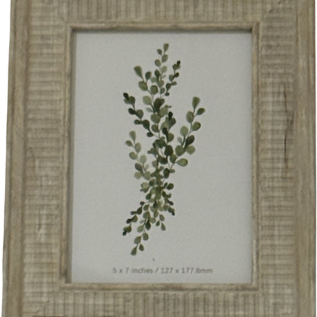 Hill Interiors white wooden 5x7in photo frame with textured painted finish, displaying a green botanical eucalyptus print behind glazing.