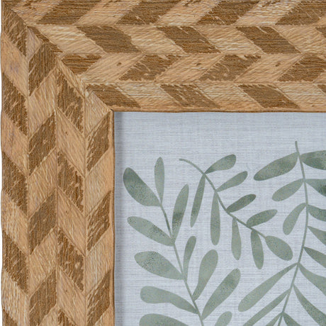Close-up of Hill Interiors Wooden Photo Frame 4x6 in brown, showing the chevron-patterned wood grain corner and green botanical print inside.
