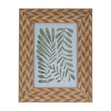 Hill Interiors 5x7 wooden photo frame in brown with a chevron-patterned timber surround, displaying a green botanical leaf print on a light background.