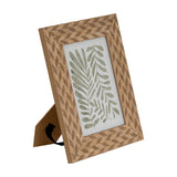 Hill Interiors 5x7 wooden photo frame in brown with a geometric diamond pattern, back strut visible, displaying a green leaf print on a white background.