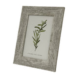 Hill Interiors Wooden Photo Frame 4x6 in a distressed white finish, displayed upright at an angle with a botanical print insert on a plain white background.