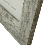 Close-up of Hill Interiors Wooden Photo Frame 4x6 in white, showing mitred corner detail and a mottled grey painted finish with size label visible.