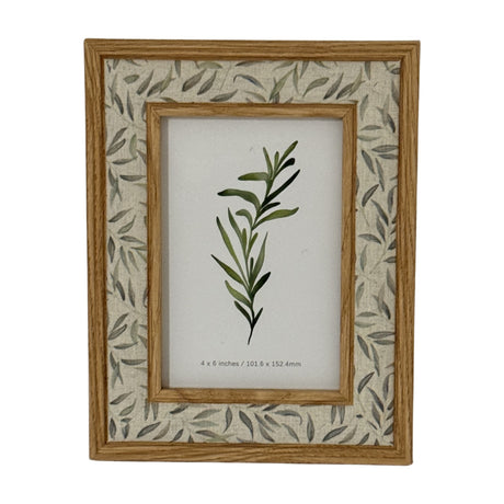 Hill Interiors wooden photo frame in brown with a 4x6in aperture and leaf-patterned fabric mount, shown upright on a plain white background.