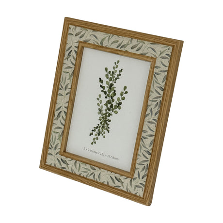 Hill Interiors 5x7in wooden photo frame in brown with a leaf-patterned inner mount, displayed at an angle on a plain white background.