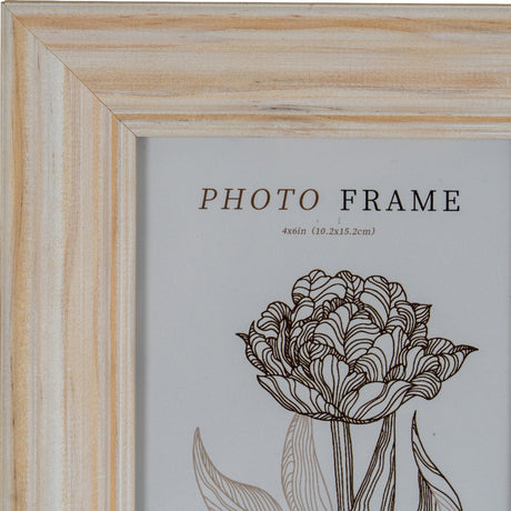 Close-up of Hill Interiors Wooden Photo Frame 4x6 in white, showing the painted wood corner with visible grain and a floral insert print.
