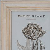Close-up of the Hill Interiors Wooden Photo Frame 5x7 in white, showing the painted timber corner with visible grain and a slim moulded profile.