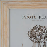 Hill Interiors 8x10 wooden photo frame with a white washed finish and gently profiled edge, shown in close-up on the top left corner.