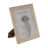 Hill Interiors wooden 8x10 photo frame in a whitewashed finish with profiled edge, shown angled with kickstand back on a plain white background.