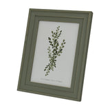 Hill Interiors wooden 5x7 photo frame with soft grey finish and visible grain, displayed at an angle showing a botanical print, on a white background.