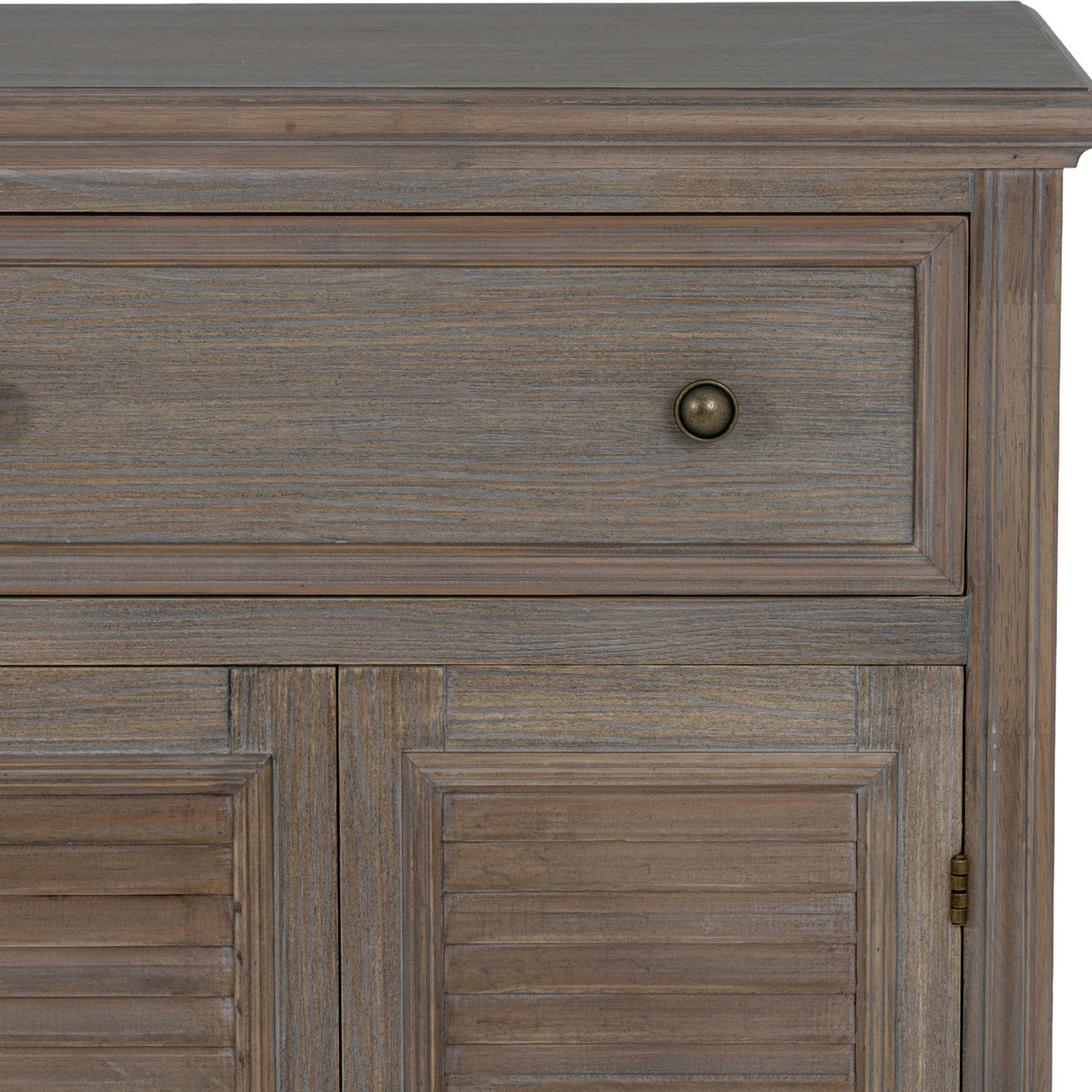 Close-up of the Hill Interiors 6 Door 3 Drawer Large Wooden Dresser Base in brown, showing a grained drawer front with brass knob above louvred doors.