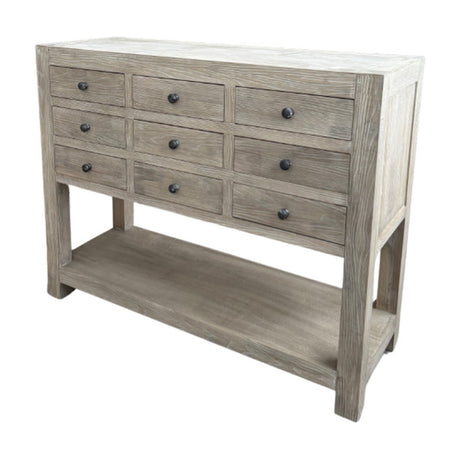 Hill Interiors 9 Drawer Wooden Chest in brown with three rows of drawers, dark round knobs and a lower open shelf, shown on a white background.