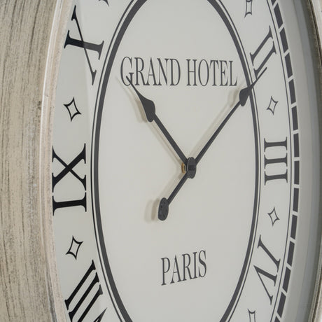 Close-up of Hill Interiors Large Round Wall Clock with grey wooden frame, glass face, Roman numerals, black hands, and Grand Hotel Paris lettering.