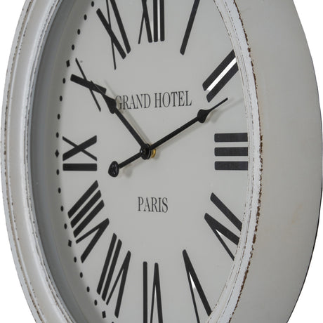 Hill Interiors Round Glass-Fronted Wall Clock in white with wooden frame, black Roman numerals, and Grand Hotel Paris text, shown at an angle.