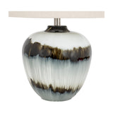 Hill Interiors Table Lamp with glass base in black and white drip finish, topped with a natural linen shade, shown on a plain white background.