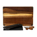 Hill Interiors acacia wood cheese board set shown with black rectangular bowl, grey slate panel and three wooden-handled cutlery pieces on a white background.
