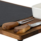 Close-up of Hill Interiors Acacia Cheese Board Set showing wooden-handled cheese knife and fork, slate insert and white ceramic bowl on brown acacia tray.