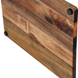Close-up of the Hill Interiors acacia cheese board showing warm honeyed wood grain and small black rubber feet at the corners.