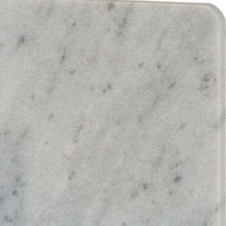 Close-up of the Hill Interiors Rectangular Marble Serving Board in white, showing the soft grey veining and rounded corner of the natural stone surface.