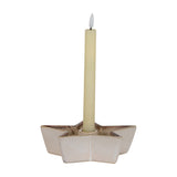 Hill Interiors Small Cement Star Candle Holder in white with a matte finish, holding a single cream taper candle, shown on a plain background.