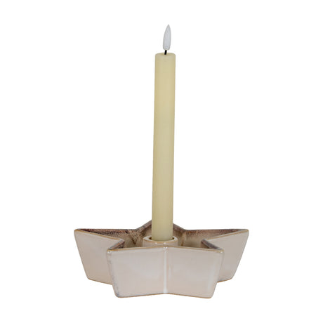 Hill Interiors Small Cement Star Candle Holder in white with a matte finish, holding a single cream taper candle, shown on a plain background.