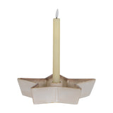 Hill Interiors large white ceramic five-pointed star candle holder with a central well holding a tall cream taper candle on a white background.