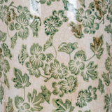 Close-up of Hill Interiors Large Tall Ceramic Clover Olpe Vase showing crackle-glaze surface with green floral and leaf pattern on a cream ground.