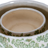 Close-up of Hill Interiors Small Clover-Shaped Ceramic Bowl showing the crackle-glazed white interior and green floral patterned scalloped rim.
