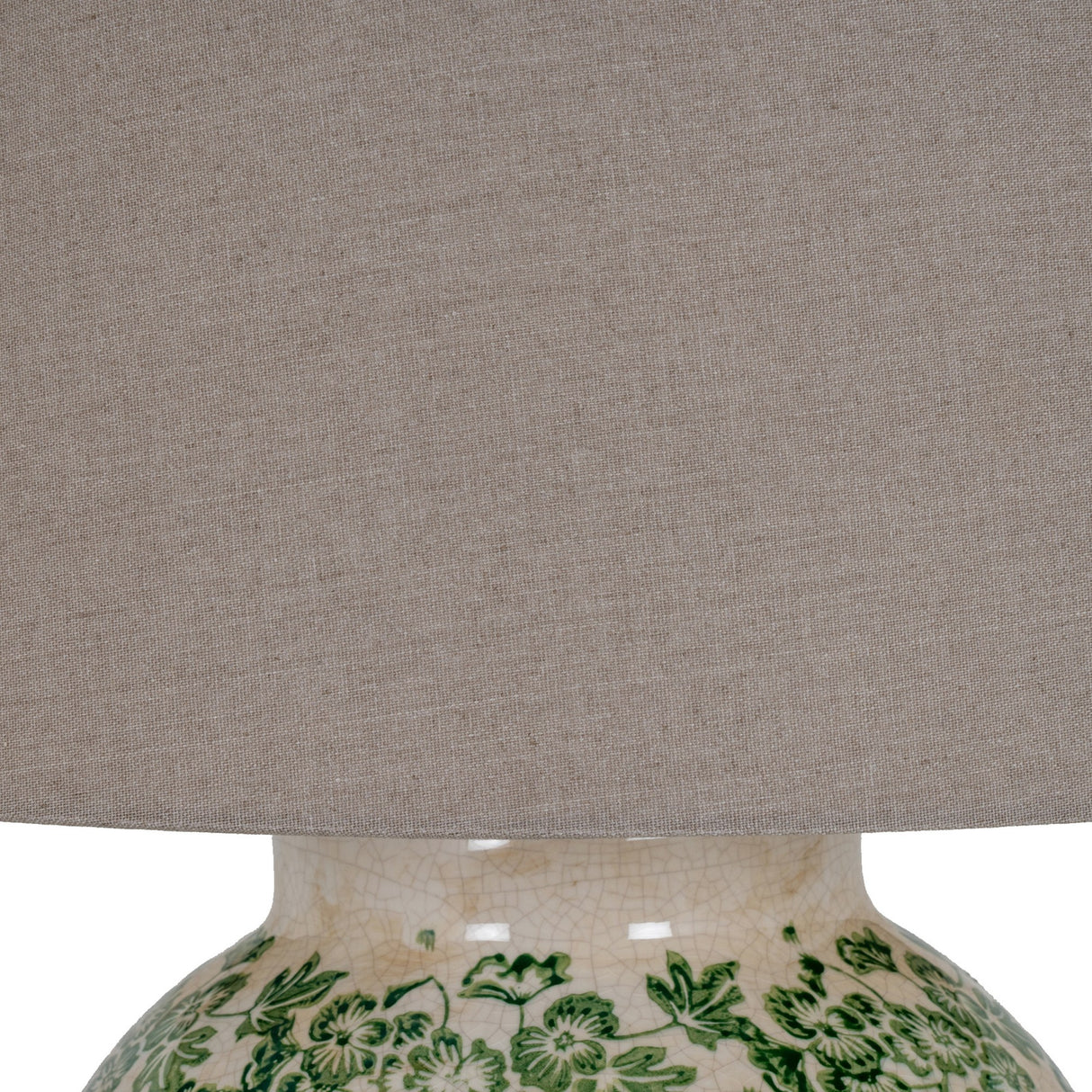 Close-up of Hill Interiors Ceramic Pot Table Lamp with green floral crackle-glaze base and natural linen drum shade.