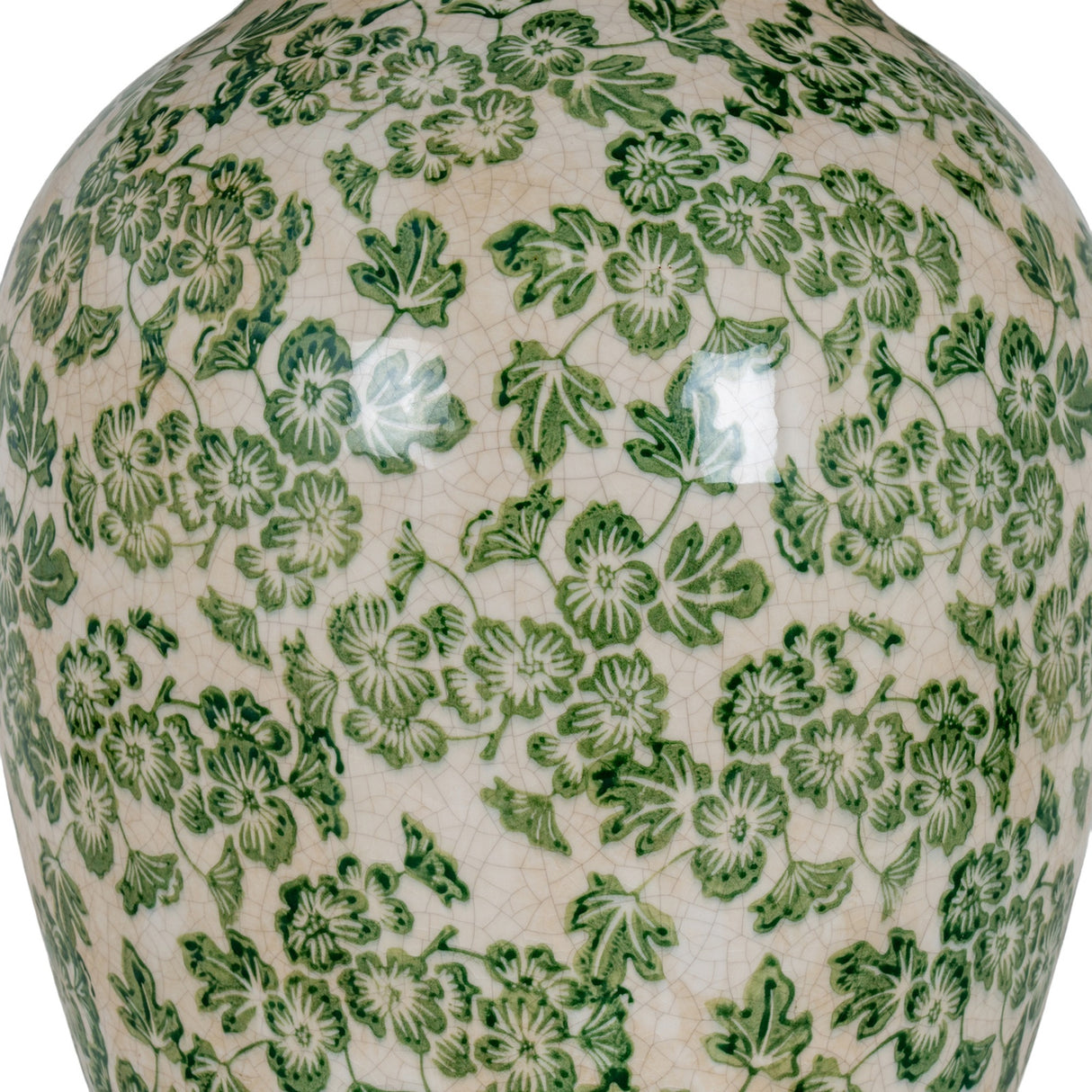 Close-up of the Hill Interiors Ceramic Pot Table Lamp base showing a crackle-glazed surface with green floral and leaf patterns on a cream ground.