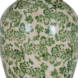 Close-up of the Hill Interiors Ceramic Pot Table Lamp base showing a crackle-glazed surface with green floral and leaf patterns on a cream ground.